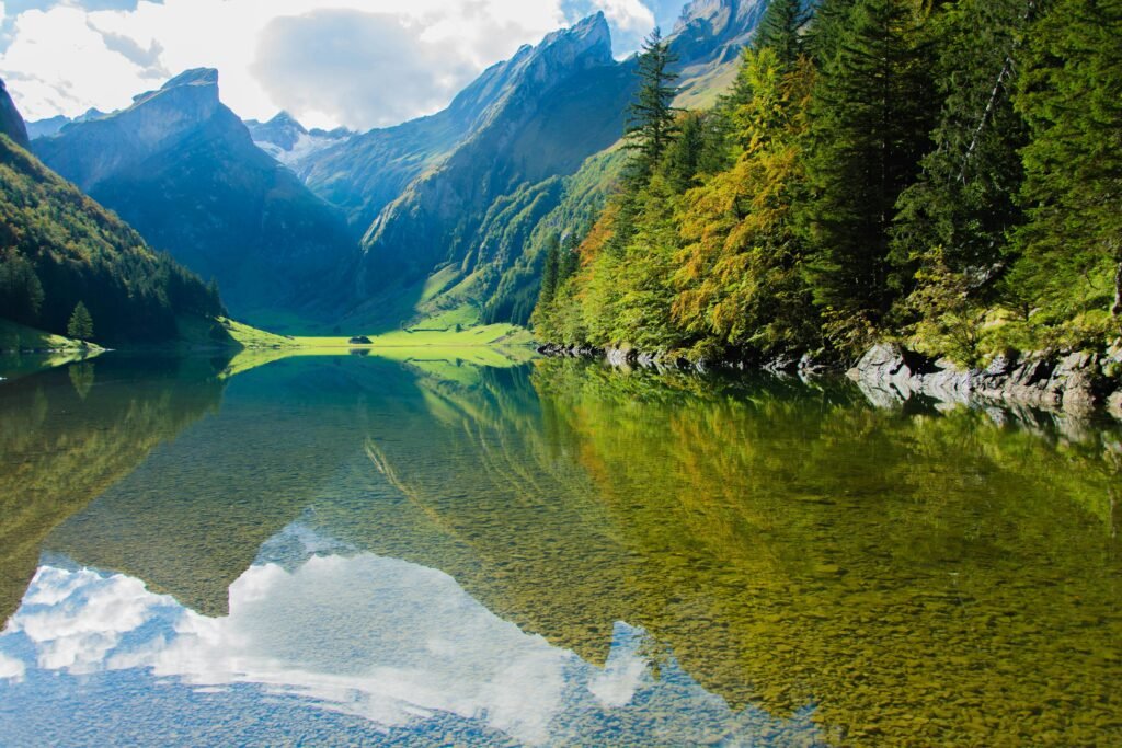pexels-photo-289472-289472 A serene mountain lake with clear reflections and lush greenery, perfect for nature enthusiasts.
